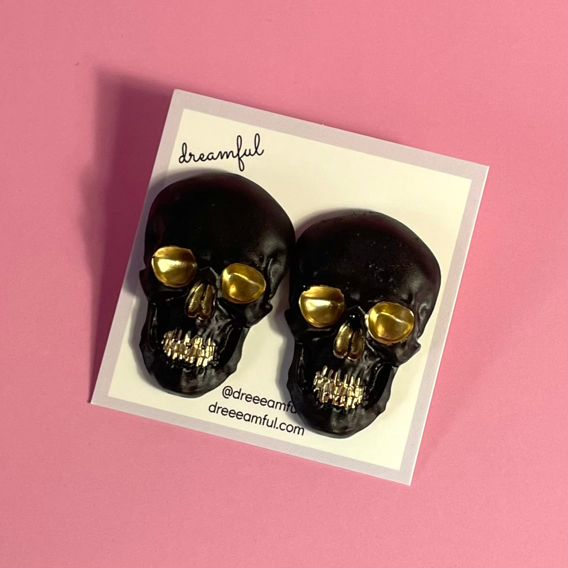 black & gold skull earrings