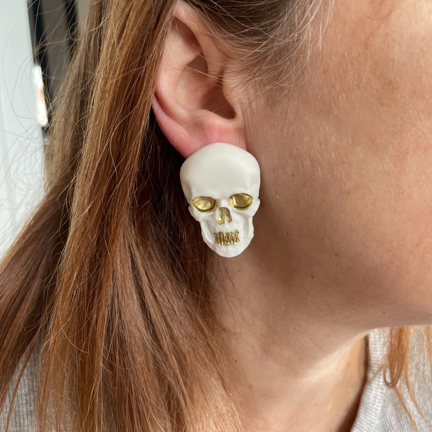 white & gold skull earrings