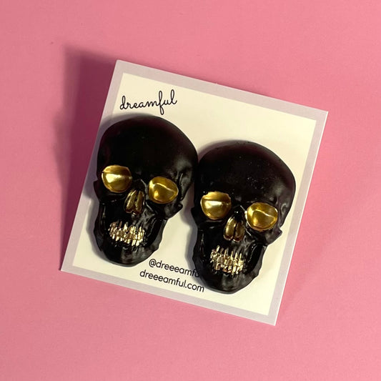 black & gold skull earrings