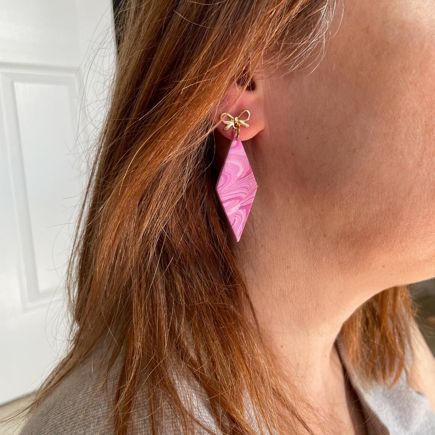 pink swirl drop earrings